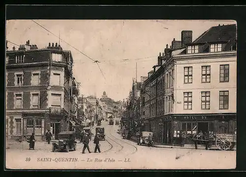 AK St-Quentin, La Rue d`Isle, Strassenbahn