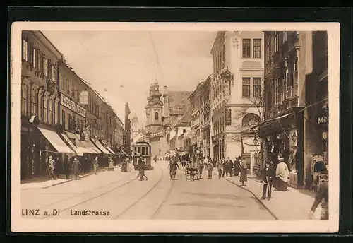 AK Linz a. D., Landstrasse mit Strassenbahn