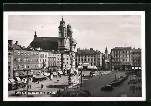 AK Linz a. d. D., Strassenbahn auf dem platz, Geschäfte und Litfasssäule