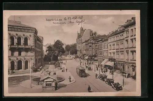 AK Saarbrücken, Reichsstrasse mit Geschäften und Strassenbahn