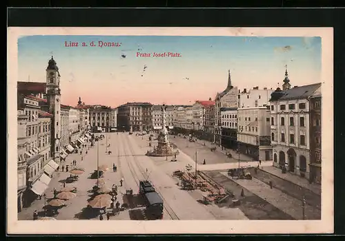 AK Linz a. d. Donau, Franz Josef-Platz mit Geschäften und Strassenbahn