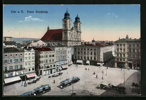 AK Linz a. D., Franz Josefplatz mit Kirche und Strassenbahn