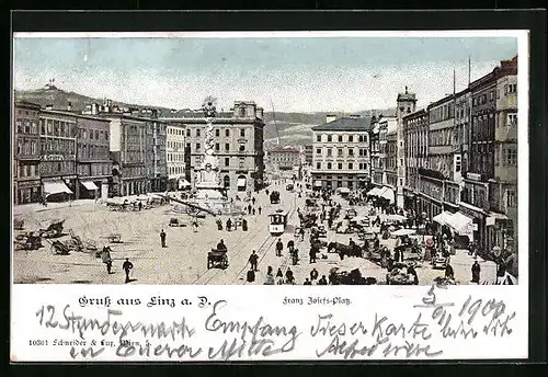 AK Linz a. D., Franz Josefs-Platz mit Geschäften und Denkmal, Strassenbahn