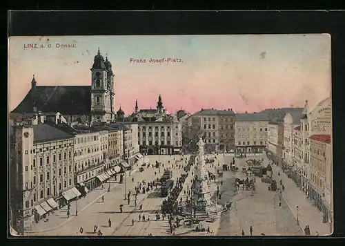 AK Linz a. d. D., Franz Josef-Platz mit Kirche und Denkmal, Strassenbahn