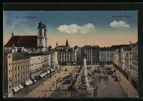 AK Linz a. D., Franz Josef-Platz mit Geschäften und Denkmal, Strassenbahn