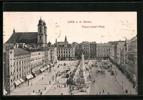 AK Linz a. d. Donau, Franz Josef-Platz mit Geschäften und Denkmal, Strassenbahn