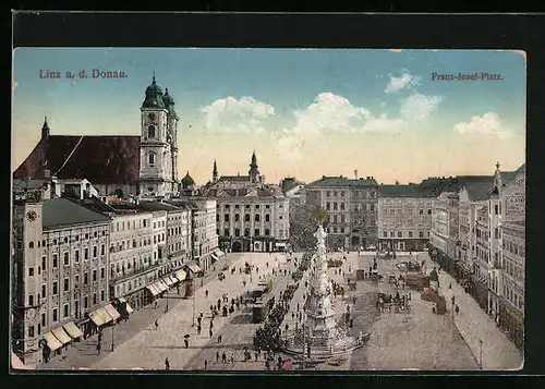 AK Linz a. d. D., Franz Josef-Platz mit Kirche und Denkmal, Strassenbahn