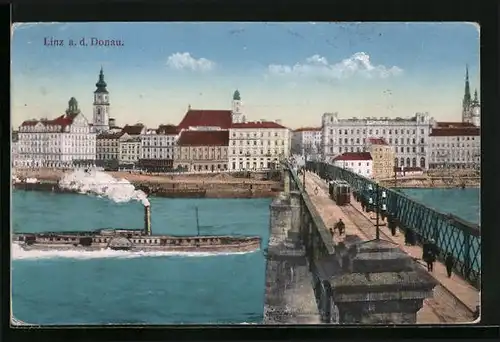AK Linz a. d. Donau, Uferpartie und Brücke mit Strassenbahn