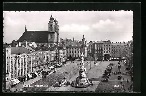 AK Linz a. D., Hauptplatz mit Geschäften und Denkmal, Strassenbahn