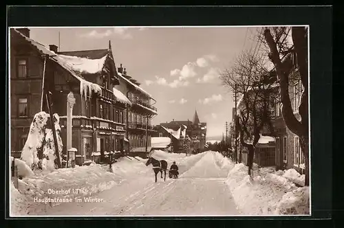 AK Oberhof i. Thür., Hauptstrasse mit Geschäft und Pferdeschlitten im Winter
