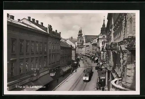 AK Linz a. d. Donau, Landstrasse mit Strassenbahn