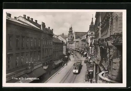 AK Linz a. d. Donau, Landstrasse mit Strassenbahn