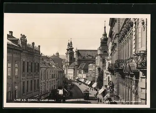 AK Linz a. d. Donau, Landstrasse mit Strassenbahn