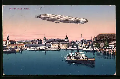 AK Konstanz a. B., Zeppelin kreuzt über dem Hafen, abfahrender Dampfer