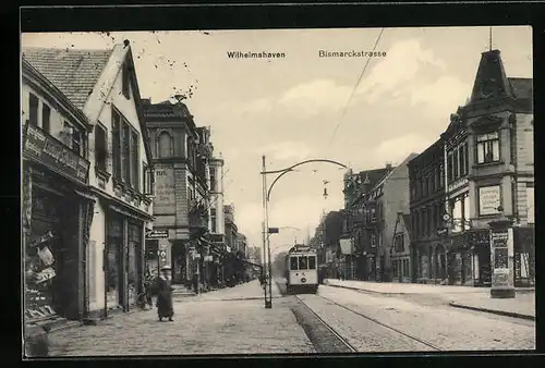 AK Wilhelmshaven, Bismarckstrasse mit Geschäften und Strassenbahn