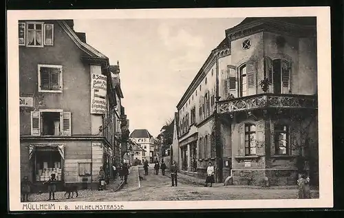 AK Müllheim i. B., Wilhelmstrasse mit Geschäften