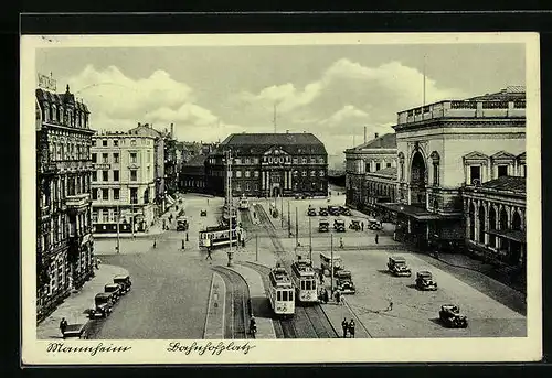 AK Mannheim, Abbiegende Strassenbahnen auf dem Bahnhofplatz