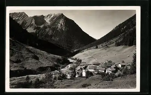 AK Namlos, Totalansicht mit Kirche und Bergpanorama