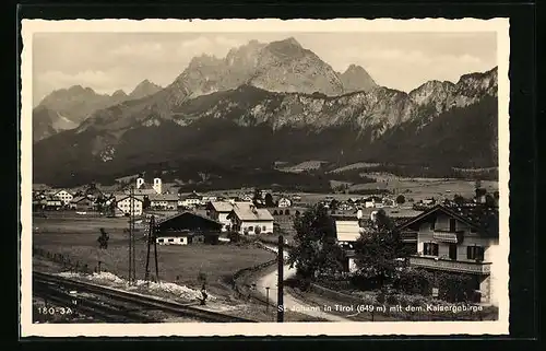 AK St. Johann, Ortsansicht mit dem Kaisergebirge