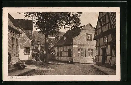 AK Travemünde, Strassenpartie mit Fachwerkhaus