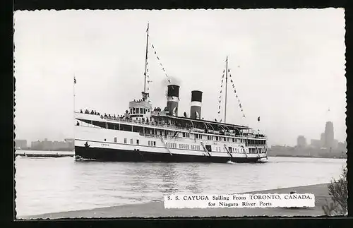 AK Passagierschiff SS Cayuga in Flaggengala den Hafen von Toronto verlassend