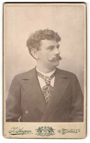 Fotografie K. Angerer, Schwaz, Portrait stattlicher Herr mit Schnurrbart und lockigem Haar