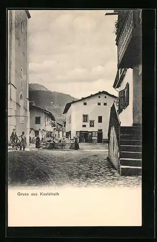 AK Kastelruth, Strassenpartie am Brunnen