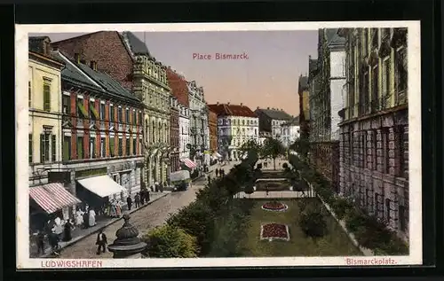AK Ludwigshafen a. Rh., Bismarckplatz mit Geschäften und Gartenanlage