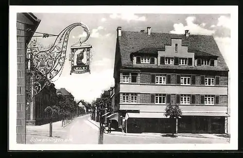AK Schwenningen a. N., Strassenpartie mit Gasthaus und Geschäft