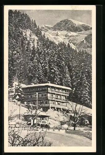 AK Berchtesgaden, Fremdenheim Haus Körber, Am Bahnhof, Ansicht im Schnee