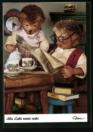 AK Mecki sitzt lesend am Frühstückstisch