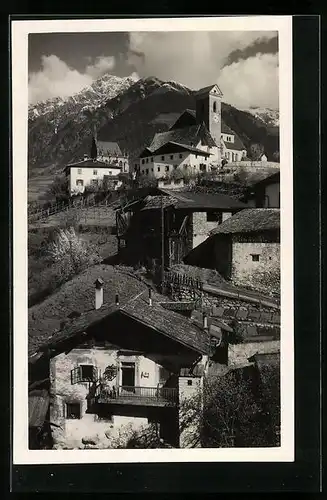 AK Schenna bei Meran, Teilansicht unter Wolkenhimmel