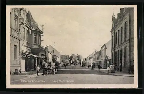 AK Osterburg /Altmark, Partie an der Strasse mit Geschäft Müller und Kindergruppe