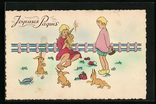 Künstler-AK Kinder spielen mit Osterhasen zum Feste