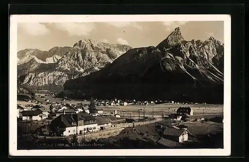 AK Seefeld, Talblick mit der gesamten Ortschaft gegen die Miemingerberge