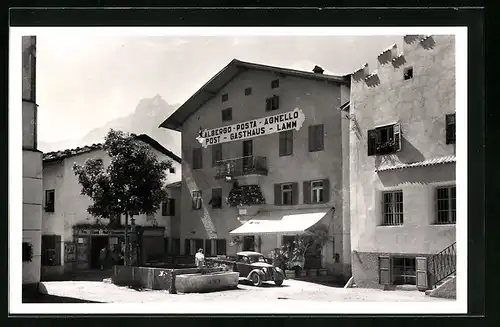 AK Kastelruth, Strassenpartie mit Post-Gasthaus-Lamm