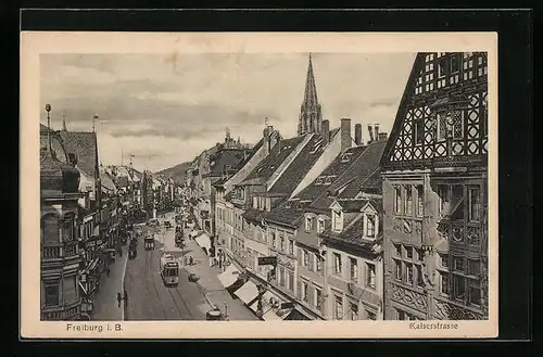 AK Freiburg i. B., Kaiserstrasse mit Geschäften und Strassenbahn