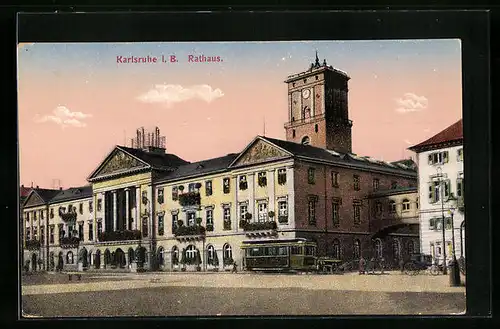 AK Karlsruhe i, B., Rathaus in der Dämmerung mit Strassenbahn