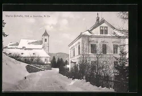 AK Maria-Schutz, Strassenpartie mit Blick auf Kirche im Winter