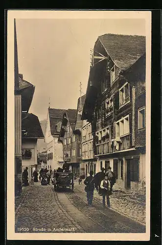 AK Andermatt, Blick in eine belebte Strasse, Fuhrwerk