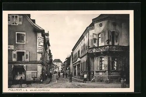AK Müllheim i. B., Wilhelmstrasse mit Geschäft