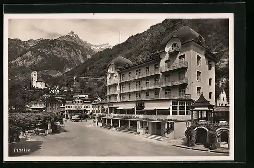 AK Flüelen, Ortspartie mit Hotel Urnerhof und Kirche