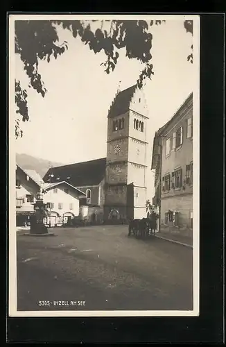 AK Inzell am See, Strassenpartie mit Pferdewagen, Uhrenturm