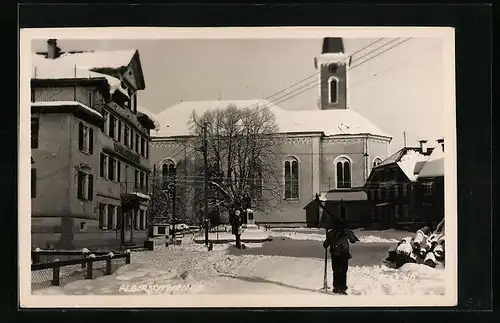 AK Alberschwende, Strassenpartie mit Kirche im Schnee