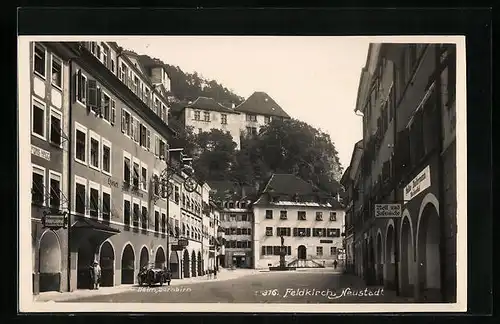 AK Feldkirch-Neustadt, Strassenpartie mit Hotel zum Loewen, Heim Dornbirn und Geschäft