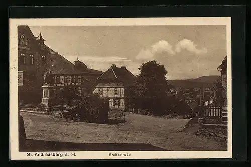 AK St. Andreasberg a. H., Breitestrasse mit Fachwerkhaus und Denkmal