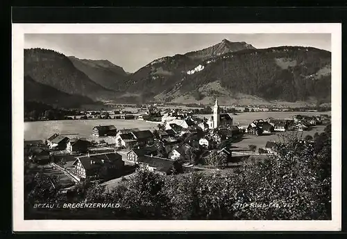 AK Bezau, Ortsansicht mit Feldern und Berggipfel