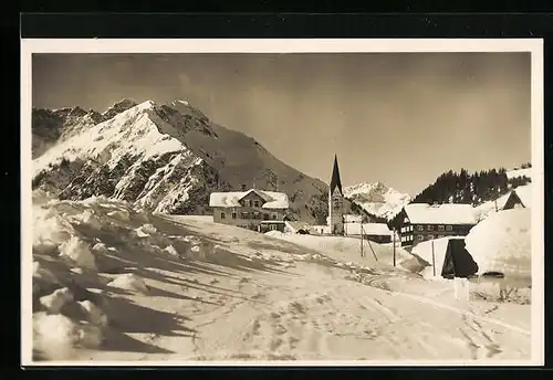 AK Mittelberg, Ortspartie mit Widderstein im Winter