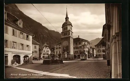 AK Altdorf, Strassenpartie mit Telldenkmal und Strassenbahn