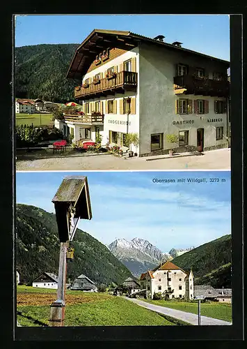 AK Oberrasen /Pustertal, Gasthof Troger, Ortspartie mit Flurkreuz und Wildgall